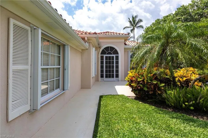 Newer accordion shutters, and a screened front entry.