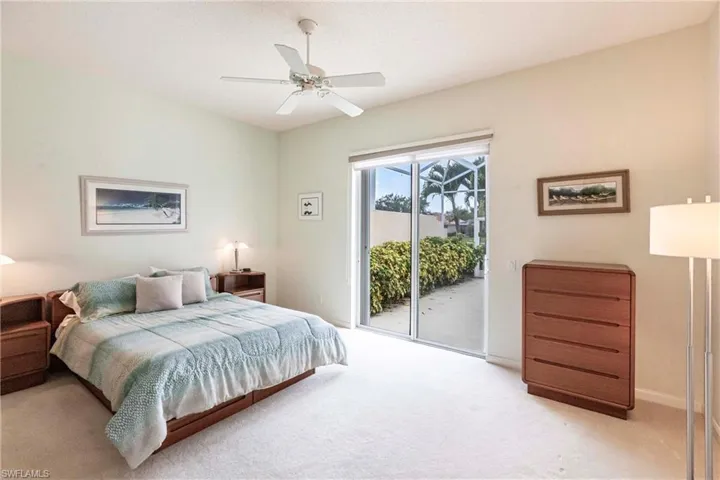 Master bedroom with sliding doors to patio.
