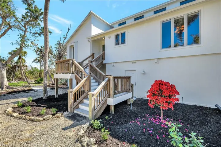 Back of house with a wooden deck