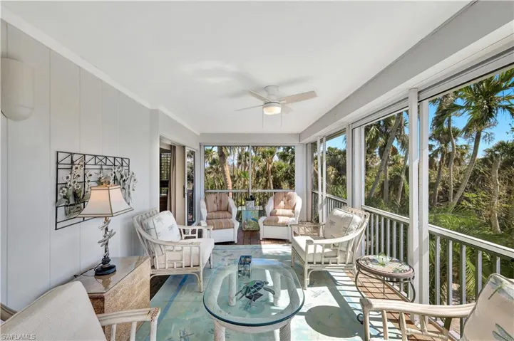 Sunroom featuring ceiling fan