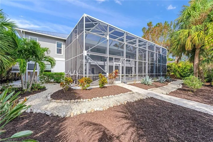 Back of house featuring a lanai