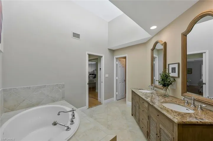 Primary bath has both soaking tub and walk-in shower.
