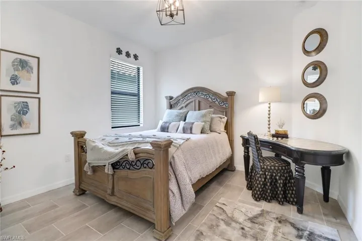 3rd Bedroom with a notable chandelier