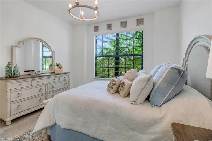 2nd Bedroom with an inviting chandelier