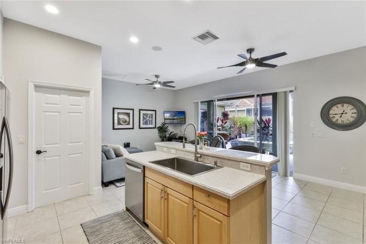 Sink area overlooks Breakfast Bar, Dinette and combined Family Rm