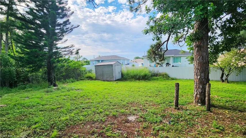 View of yard featuring a storage unit