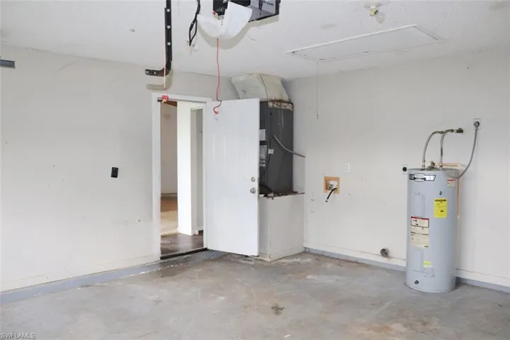 Garage featuring water heater