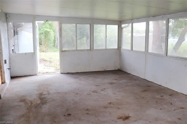 Unfurnished sunroom with a healthy amount of sunlight