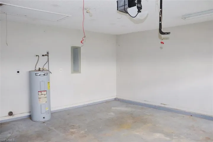 Garage with a garage door opener and water heater