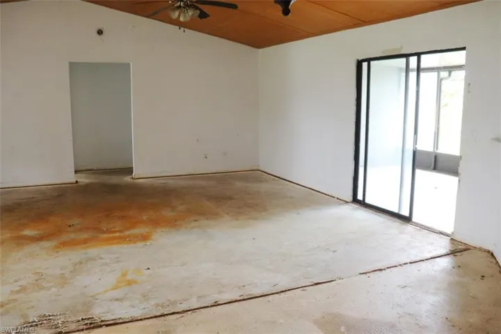Unfurnished room featuring ceiling fan