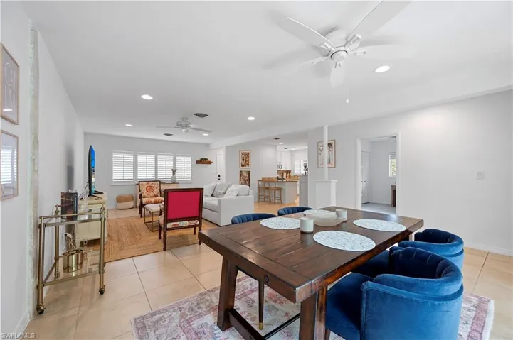 Dining space with ceiling fan, recessed lighting, and light tile patterned floors