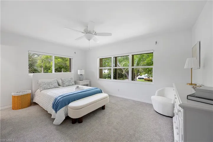 Bedroom with carpet floors and a ceiling fan