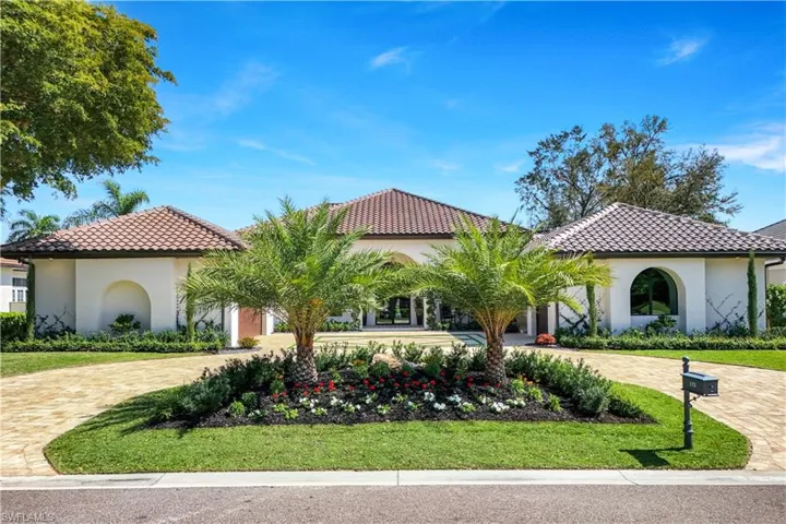 Mediterranean / spanish home featuring a front yard