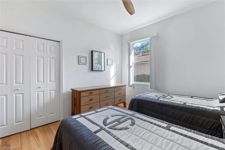Bedroom featuring a closet, ceiling fan, and light wood-type flooring