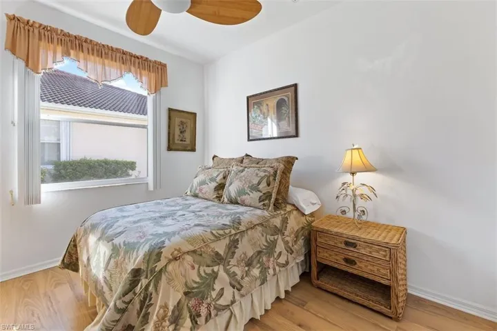 Bedroom with wood-type flooring and ceiling fan