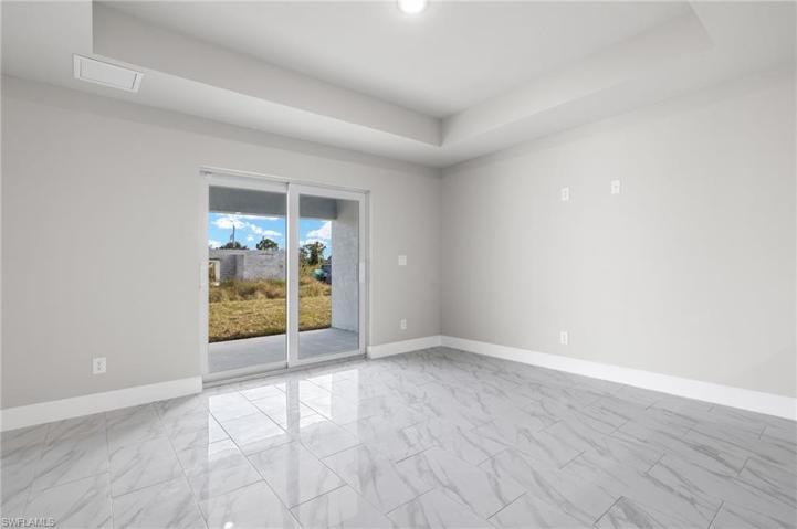 Porcelain tile throughout the entire duplex with tray ceilings in the living room
