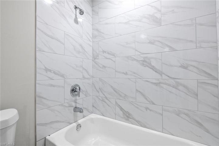 Ceiling to tub tile
