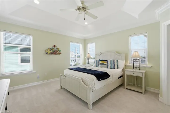 Tray ceiling with recessed lighting and crown molding - Virtually Edited Image