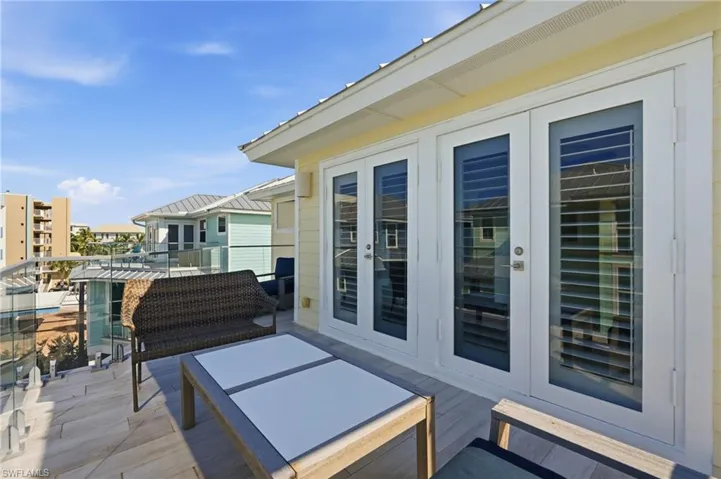 Balcony with glass railing, providing an open-air extension - Virtually Edited Image