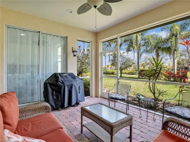 Sunroom featuring a ceiling fan