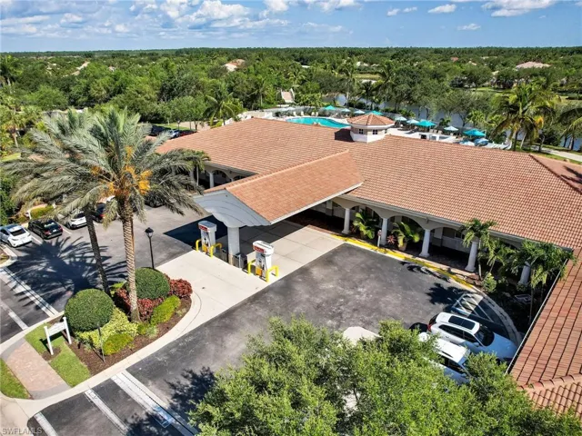 Aerial view featuring a wooded view