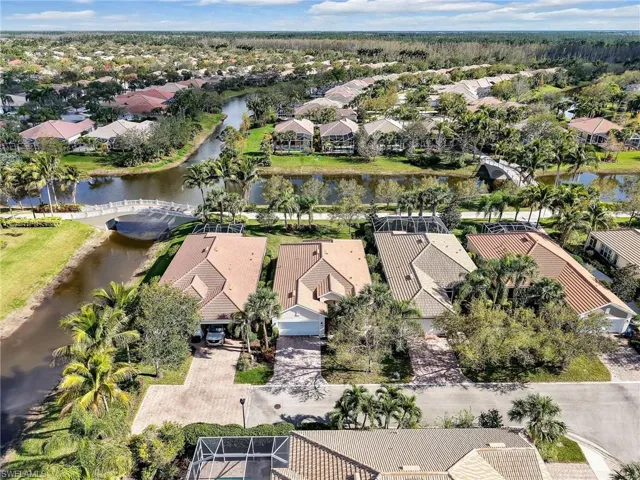 Drone / aerial view with a water view and a residential view