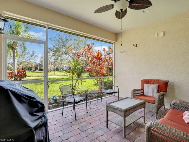 Sunroom featuring a wealth of natural light and a ceiling fan