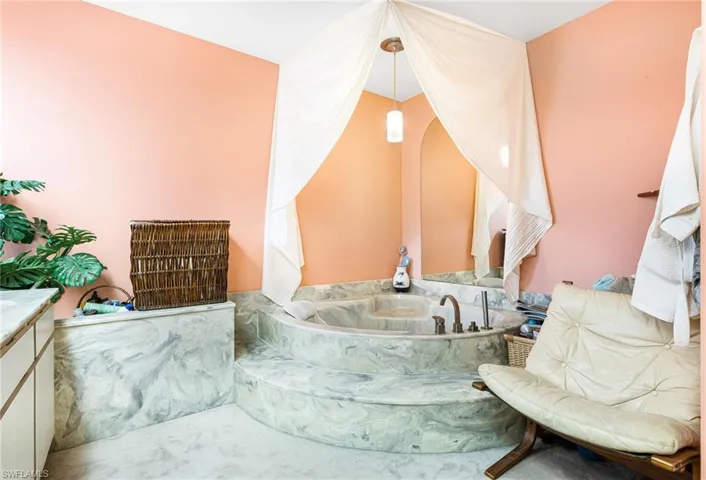 Bathroom featuring a bathtub and vanity