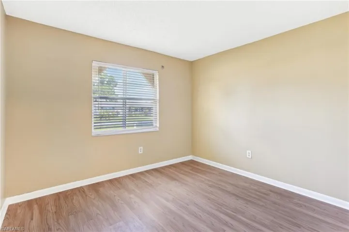 Unfurnished room featuring hardwood / wood-style floors