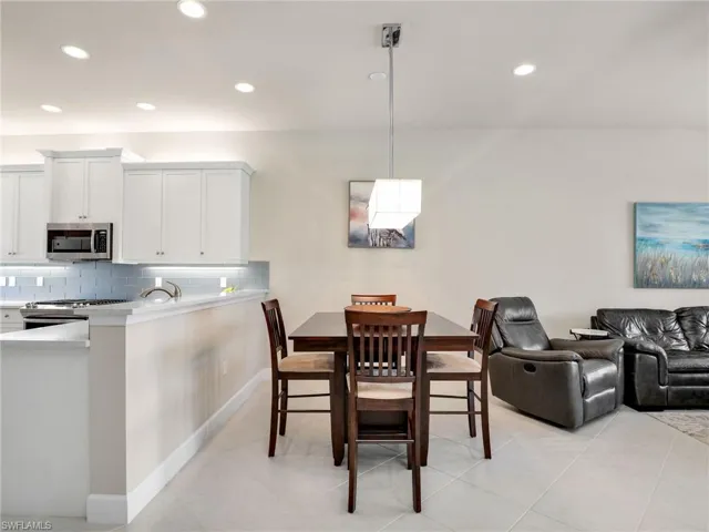 Dining space featuring light tile floors