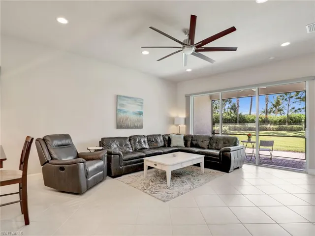 Tiled living room with ceiling fan