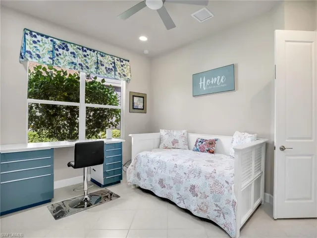 Tiled bedroom with ceiling fan
