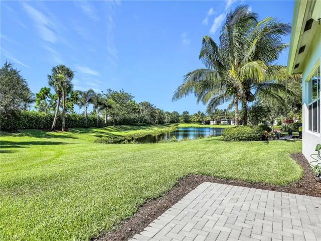 View of yard with a water view