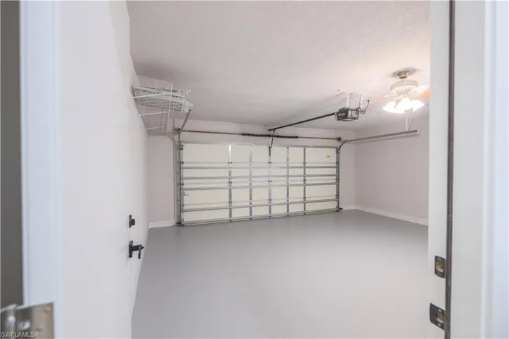 Garage featuring a garage door opener