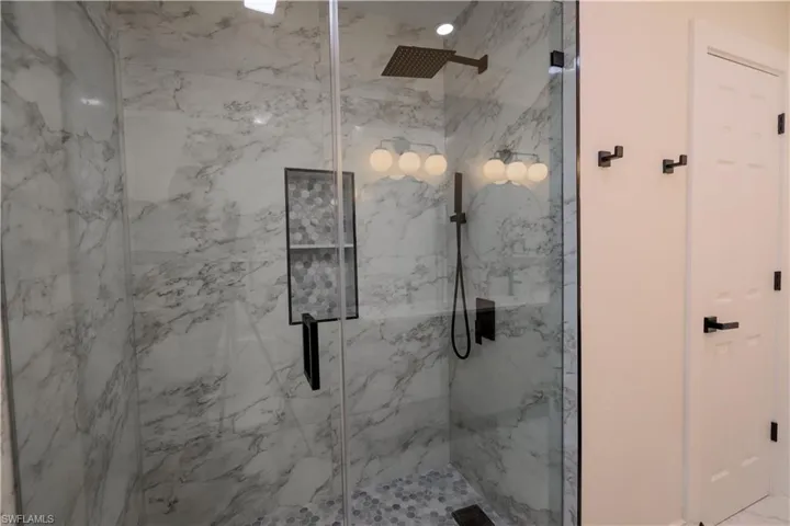 Bathroom featuring a shower with shower door
