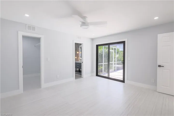 Spare room with ceiling fan