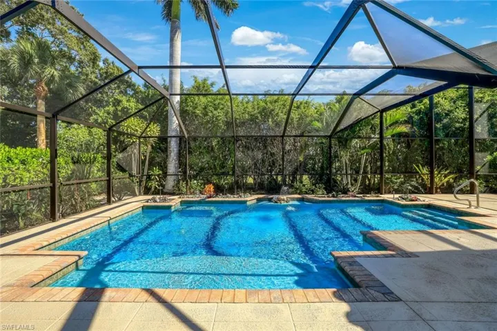 Outdoor pool with a lanai, a sunroom, and a patio