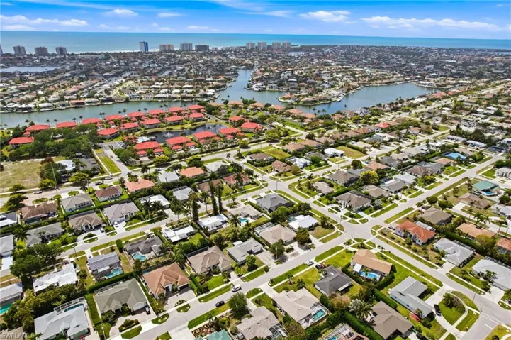 Aerial view showcasing the residential area with waterways and gulfront homes.