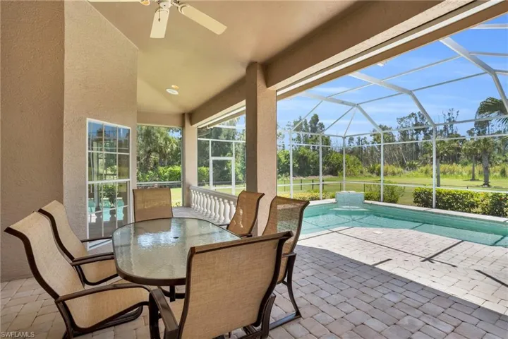 View of terrace featuring a lanai and ceiling fan