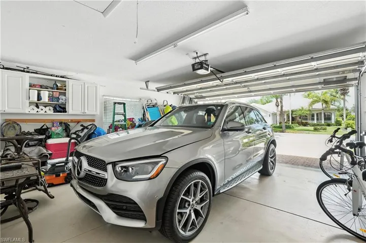Garage featuring a garage door opener