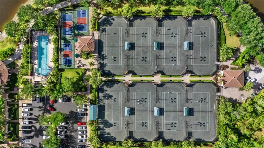 Drone / aerial view of a lap pool area, 3 pickleball courts and 8 tennis courts