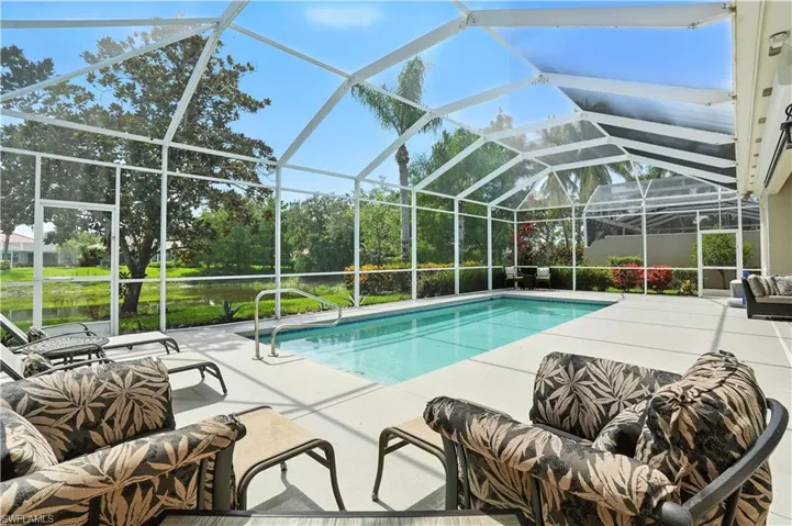 Outdoor pool with a patio area and a lanai