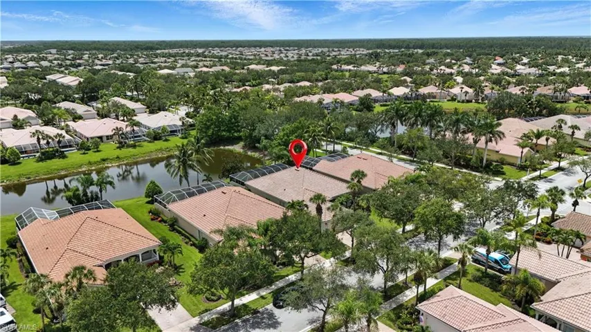 Aerial perspective of suburban area with a large body of water