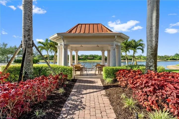 View of property's community with a gazebo and a water view