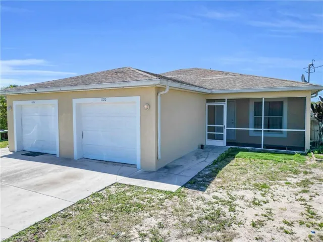 Stucco exterior with a screened front porch, dual garage doors, concrete driveway, and a shingle roof