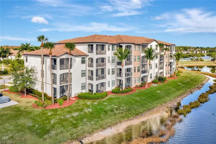 View of apartment building / complex with a water view
