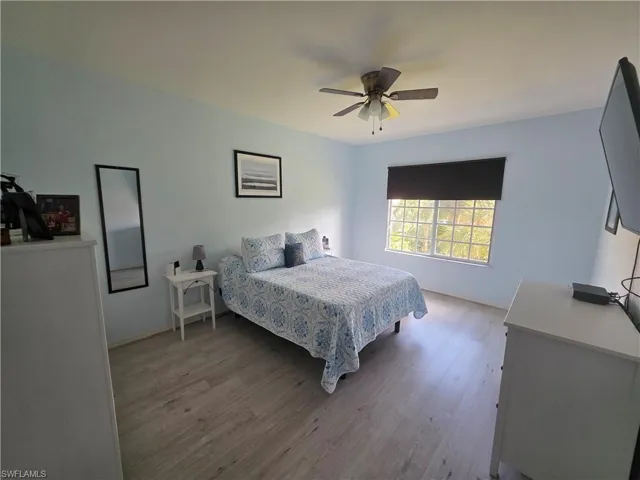 Bedroom featuring light wood-type flooring and ceiling fan