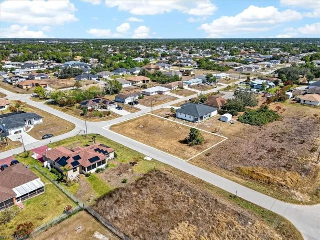 Aerial overview of property's location featuring nearby suburban area