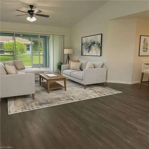 Living area generated with AI with wood finished floors, ceiling fan, and lofted ceiling