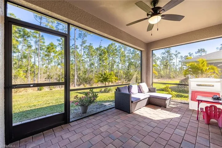 Screened lanai featuring a ceiling fan